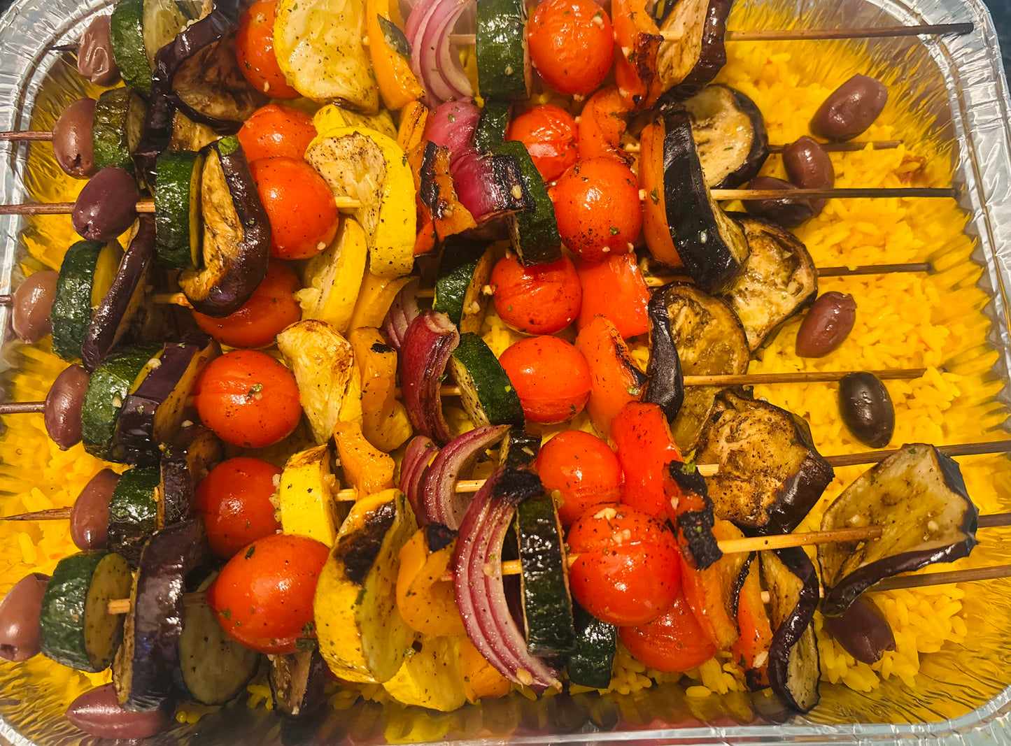 Grilled Veggie kabobs over yellow rice